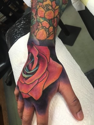  Rose hand tattoo by Brandon Notch 