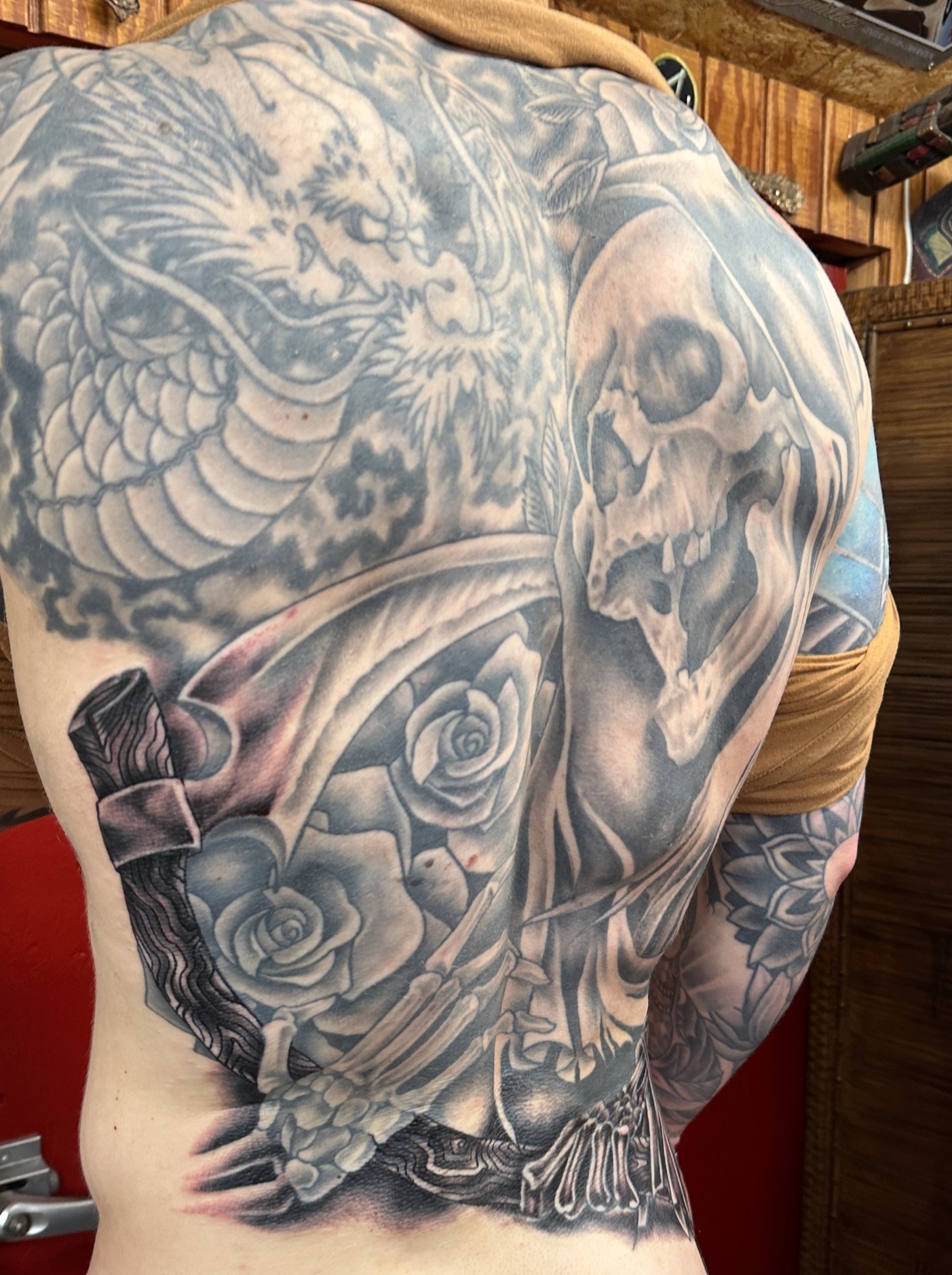  Grim Reaper with roses tattooed by Brandon Notch 