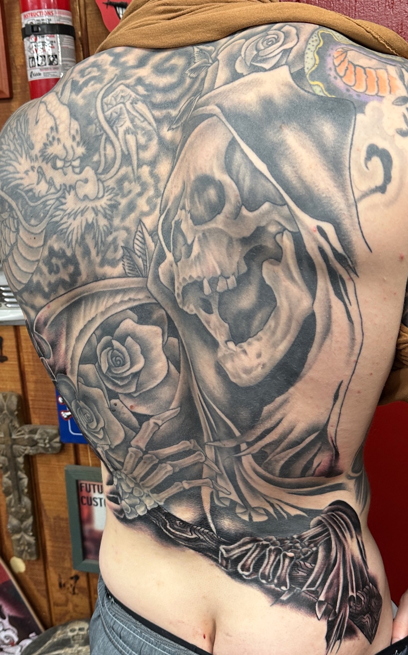  Grim Reaper with roses tattooed by Brandon Notch 