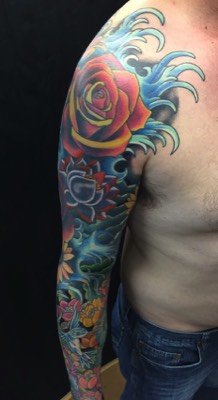  Water and flowers tattooed sleeve 