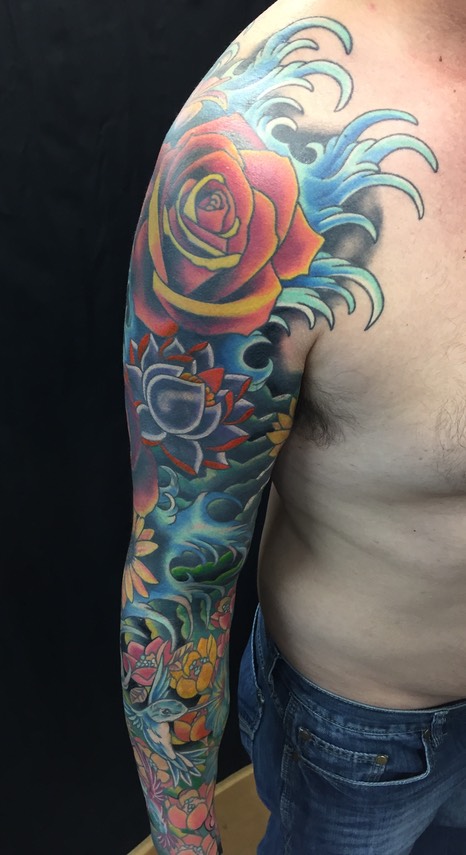  Water and flowers tattooed sleeve 