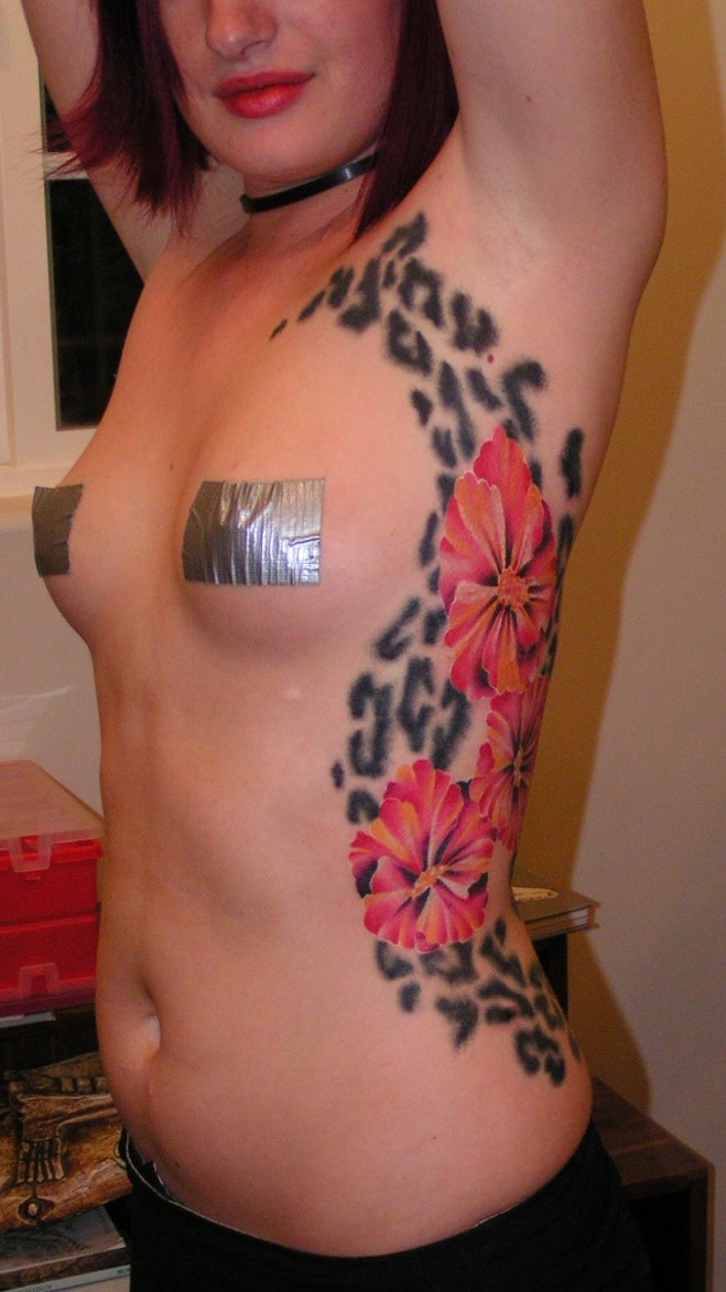  Hibiscus flower with leopard print tattoo 
