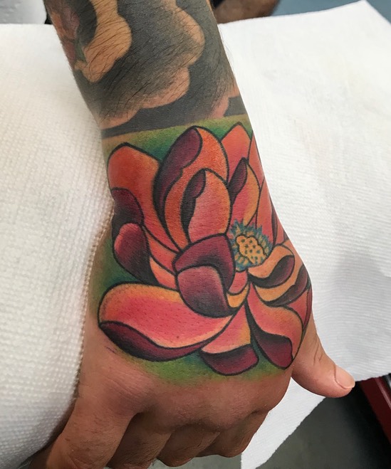  Lotus hand tattoo by Brandon Notch 