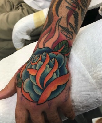  Traditional Rose hand tattoo by Brandon Notch 
