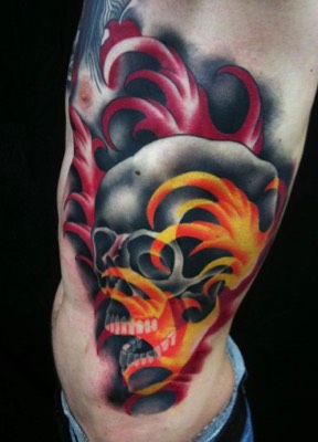  Skull with firewater tattoo by Brandon Notch 