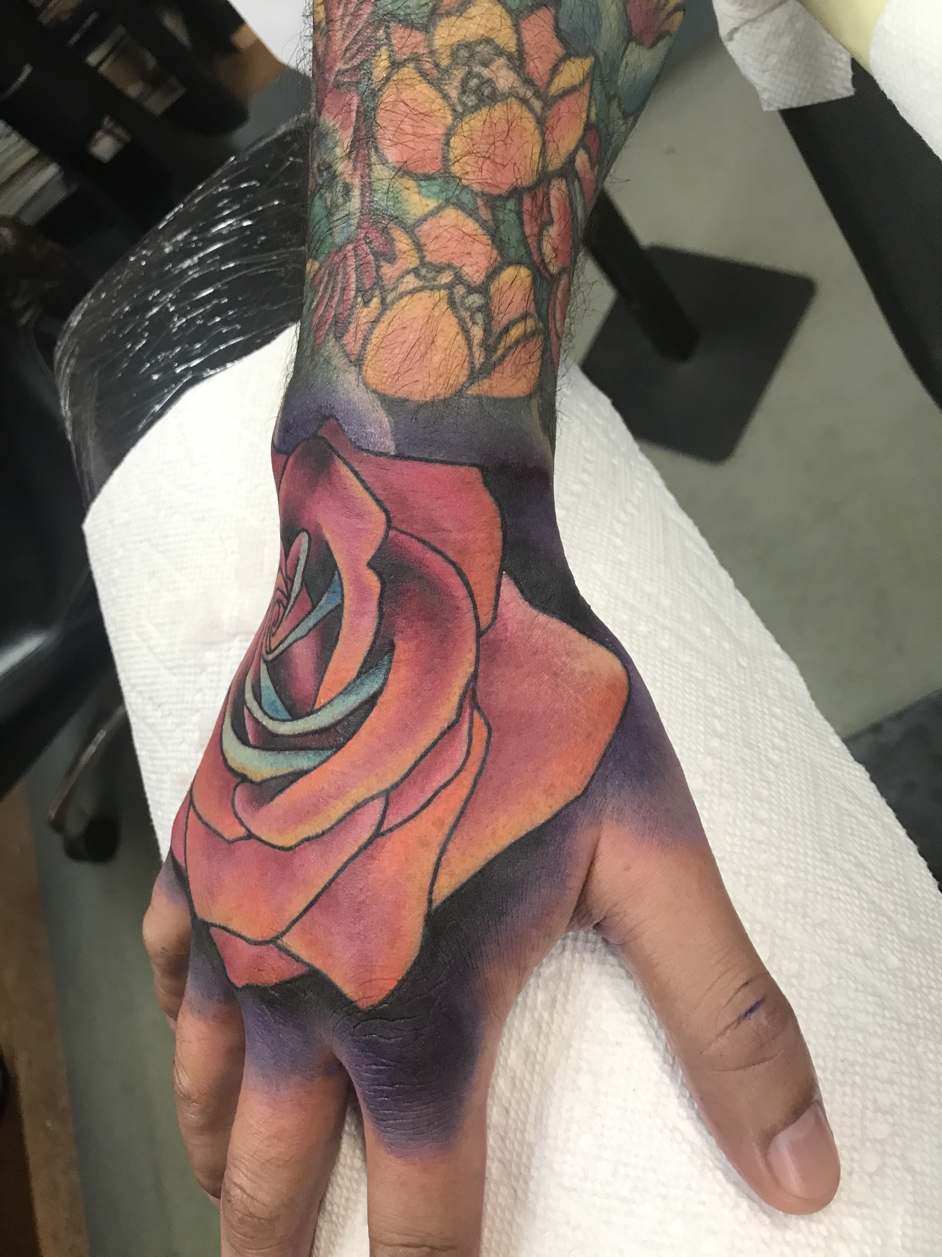  Rose hand tattoo by Brandon Notch 