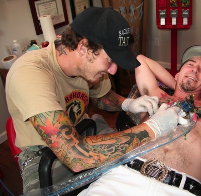  Brandon Notch tattooing a chest panel 
