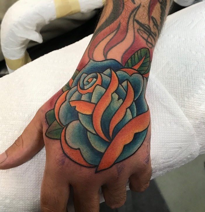  Traditional Rose hand tattoo 